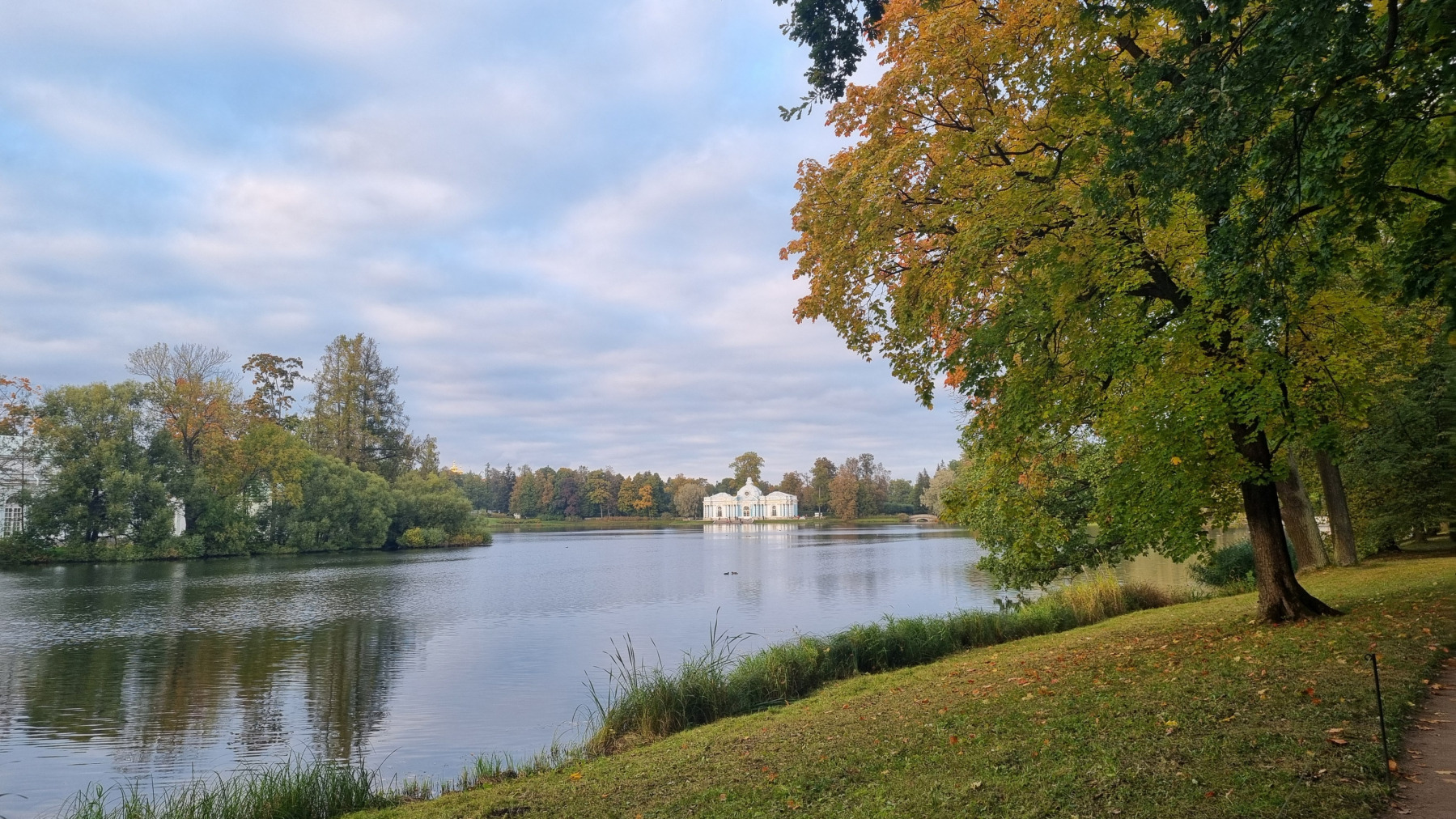 Autumn pond and historic pavilion in Pushkin city near St. Petersburg, inspiring classical music composition